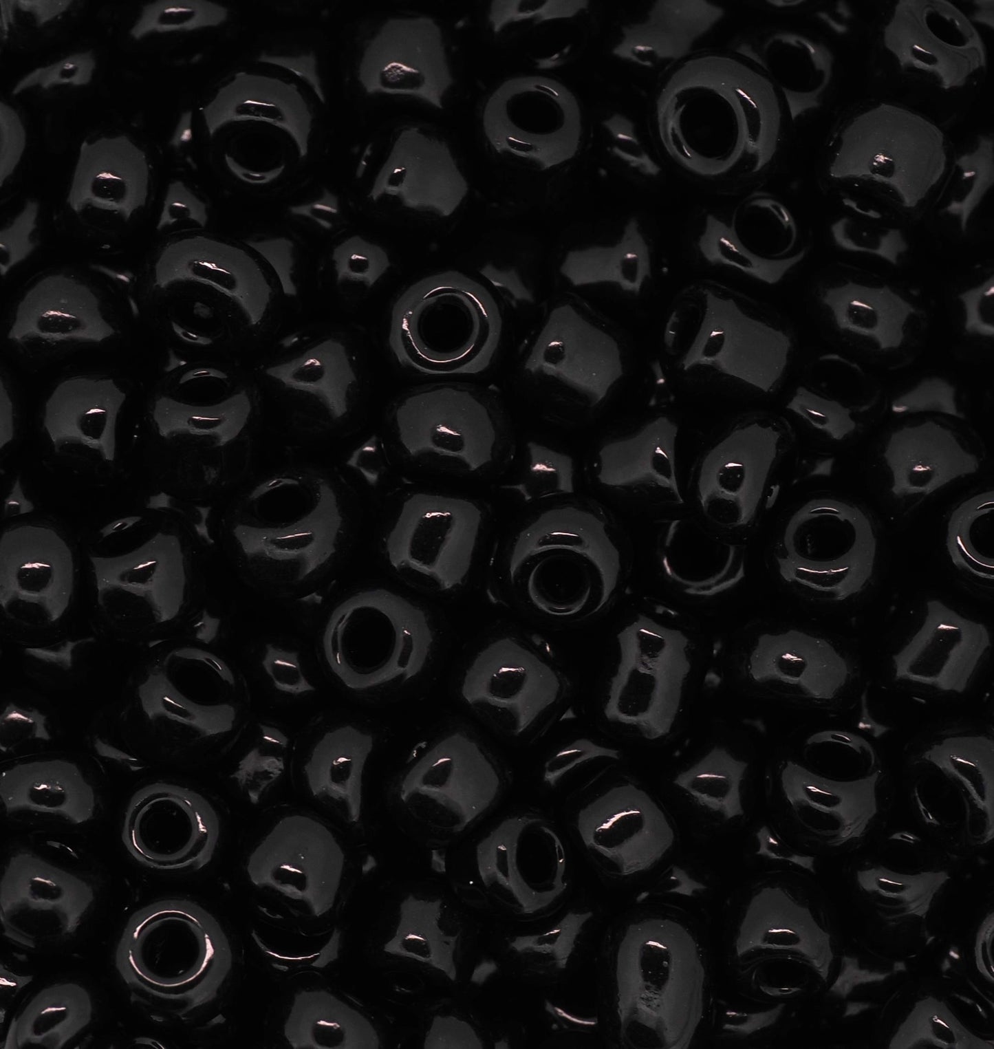 Close-up of black beads with a dark background