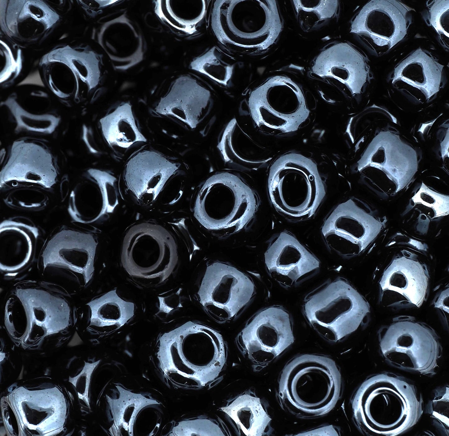Close-up of black beads with a glossy finish