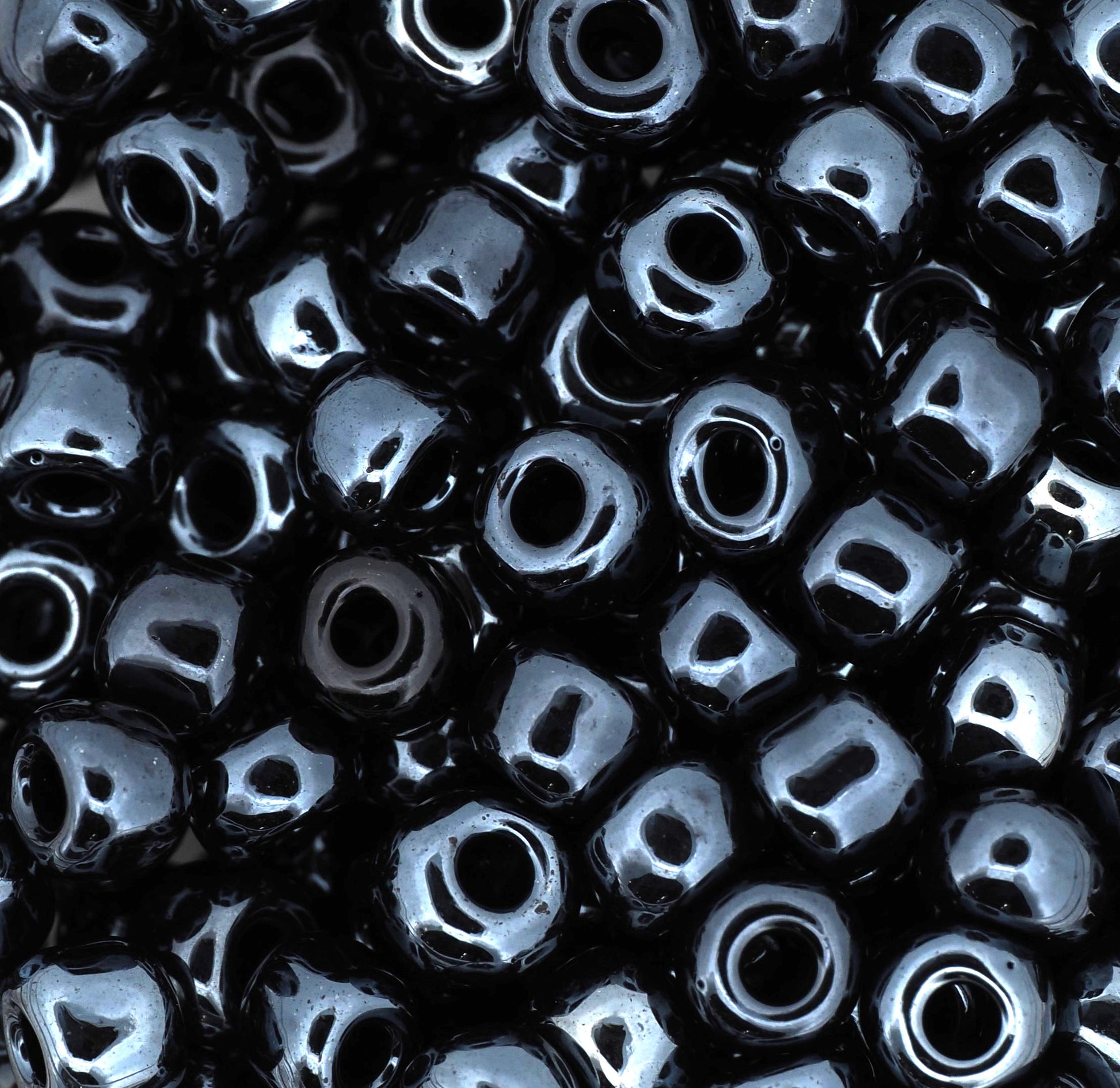 Close-up of black beads with a glossy finish