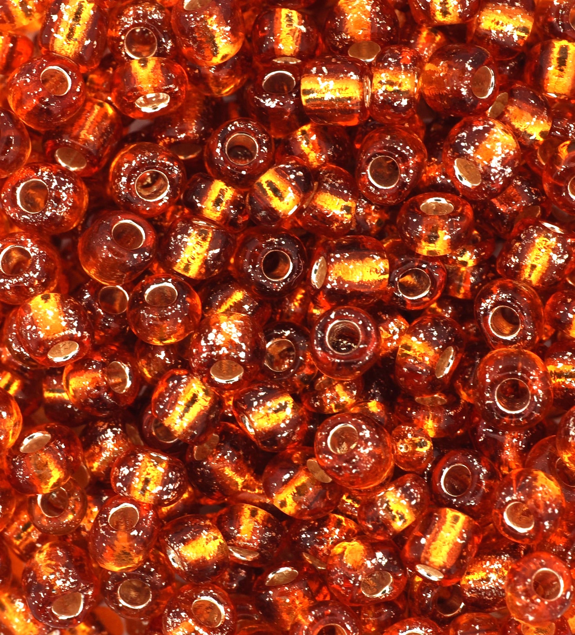 Close-up of amber-colored beads with a glossy finish