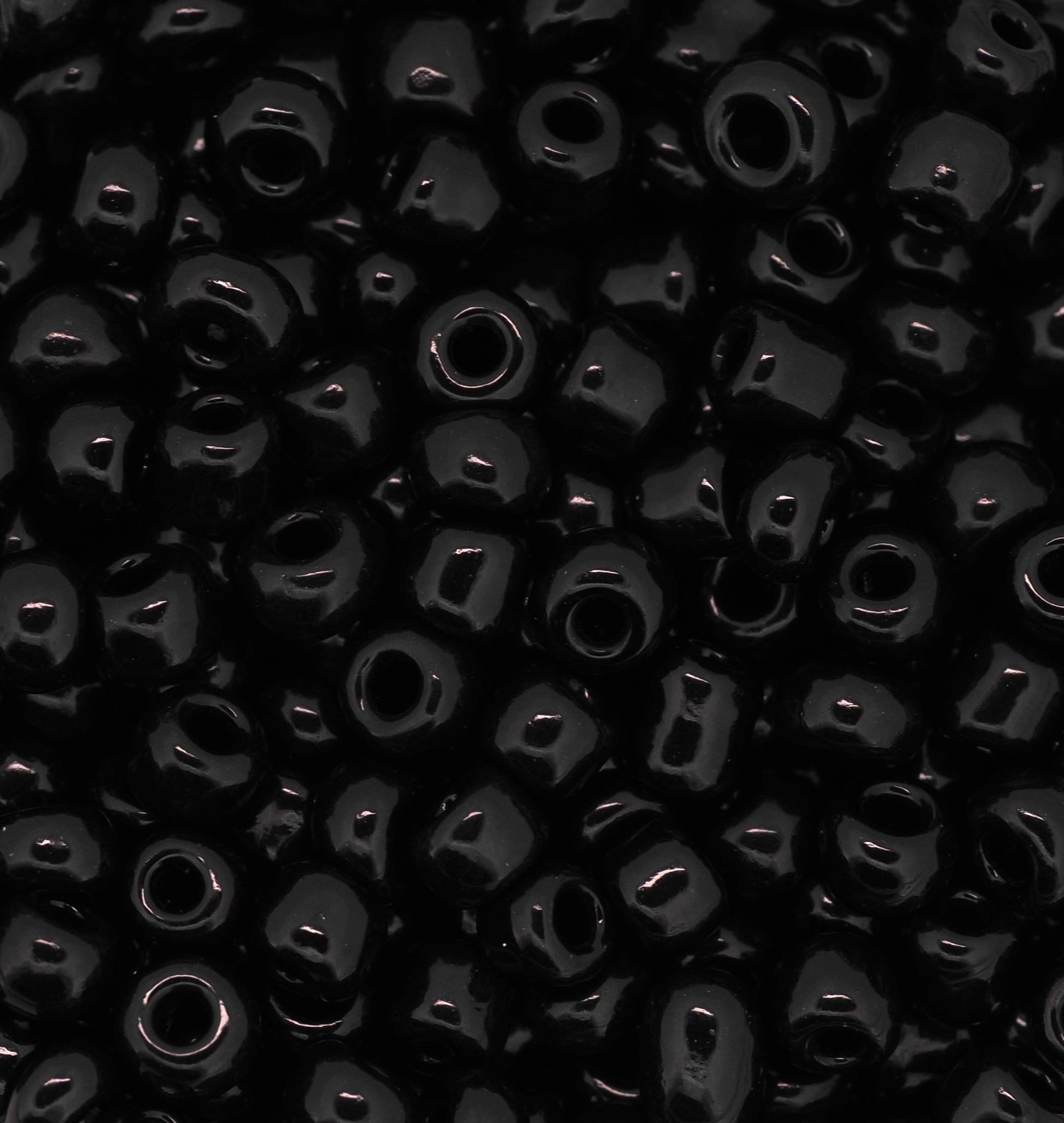 Close-up of black beads with a dark background