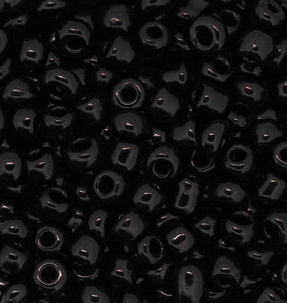 Close-up of black beads with a dark background