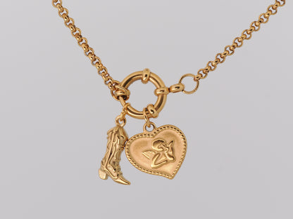 Gold necklace with two charms on a light gray background